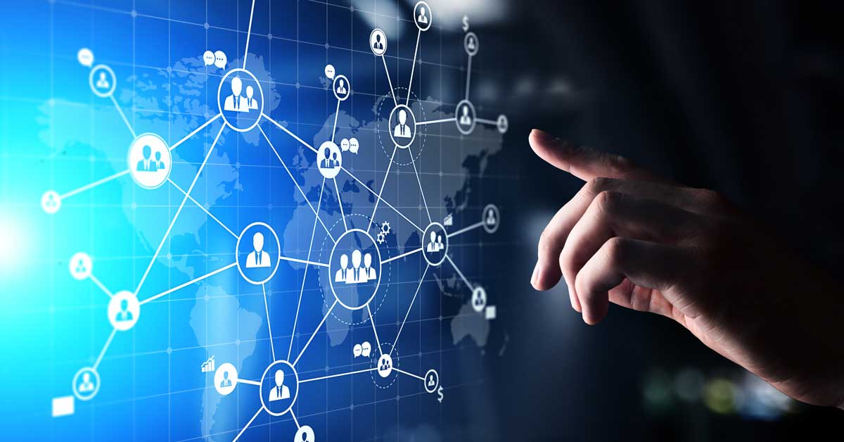 A businessman interacts with a digital screen, managing various client networks through touch technology.