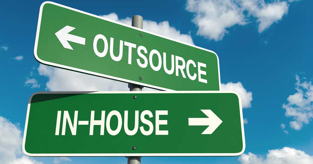 An image showing two street signs: one labeled "Outsource" pointing left and the other "In-House" pointing right.